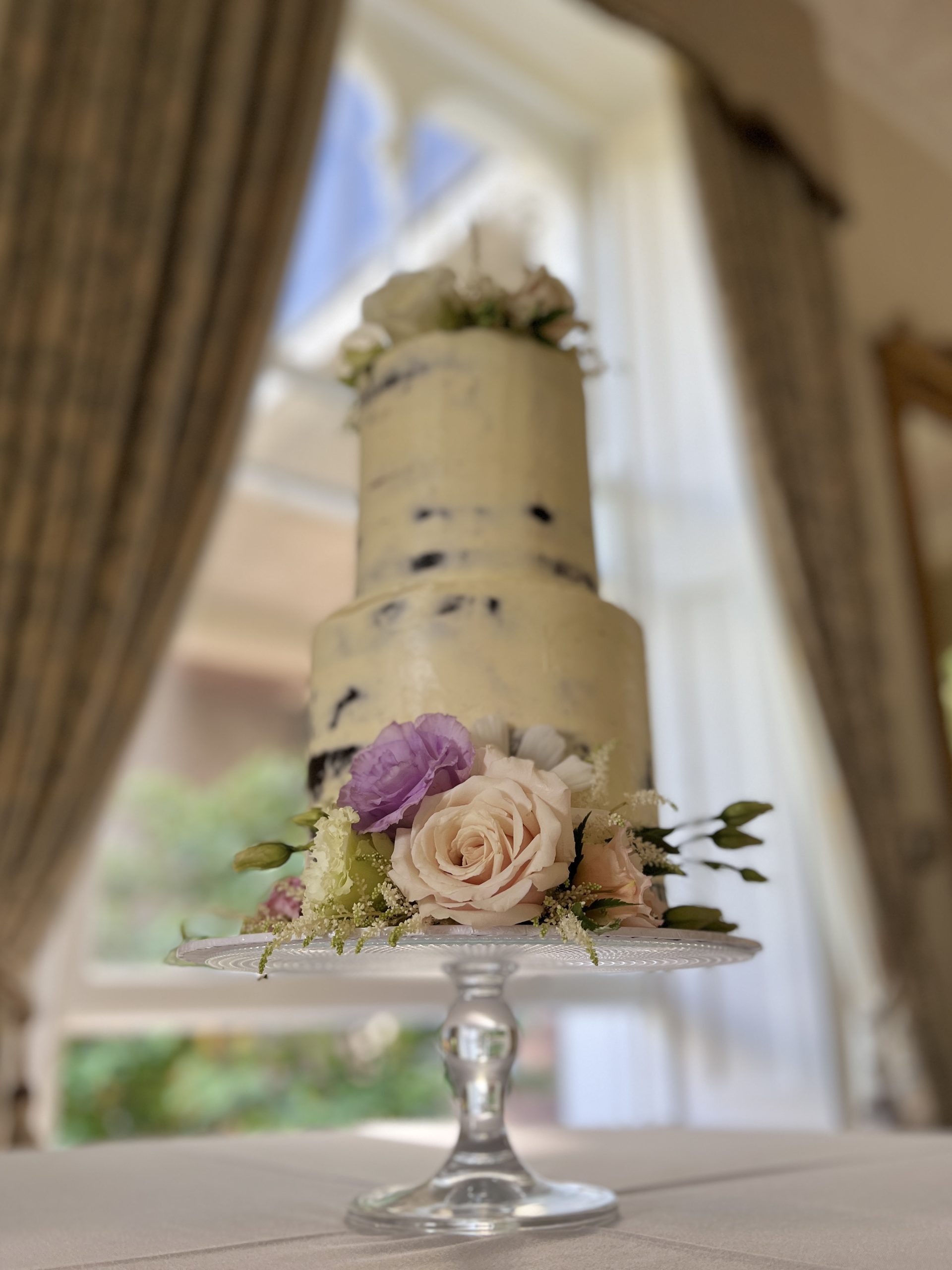 Semi naked wedding cake with fresh flowers limerick
