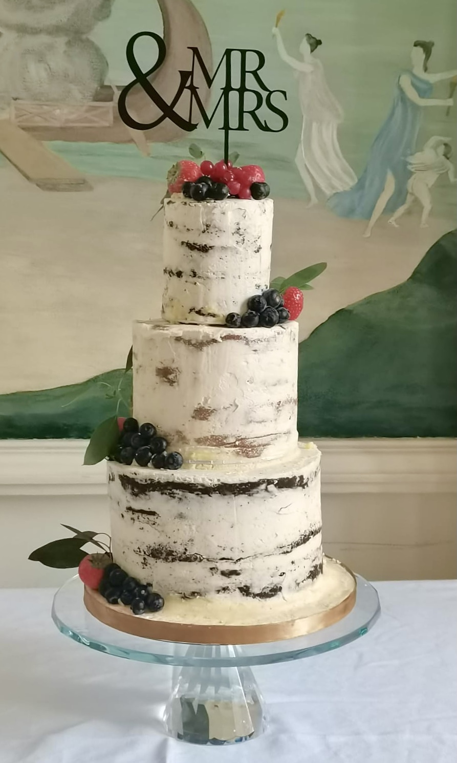 Semi naked Buttercream wedding cake with fresh flowers Tipperary