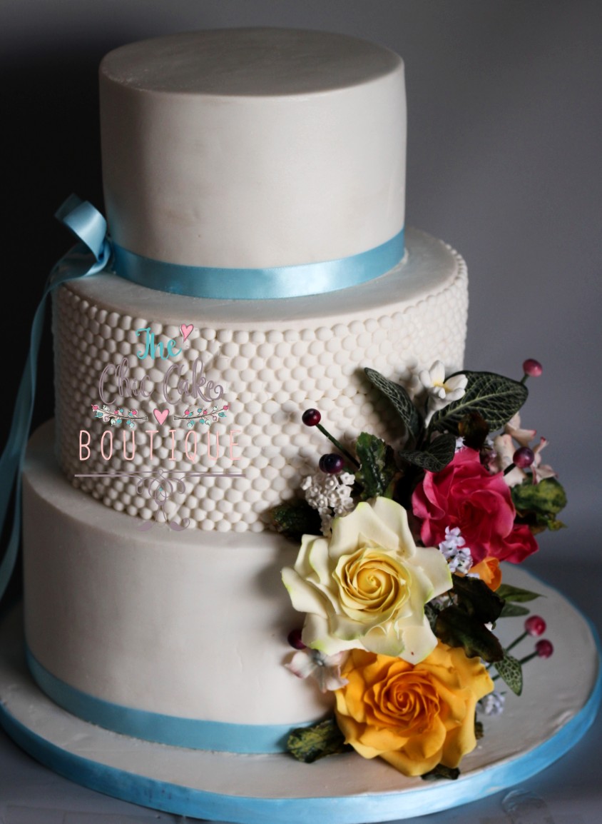 Fondant wedding cake with sugar flowers limerick