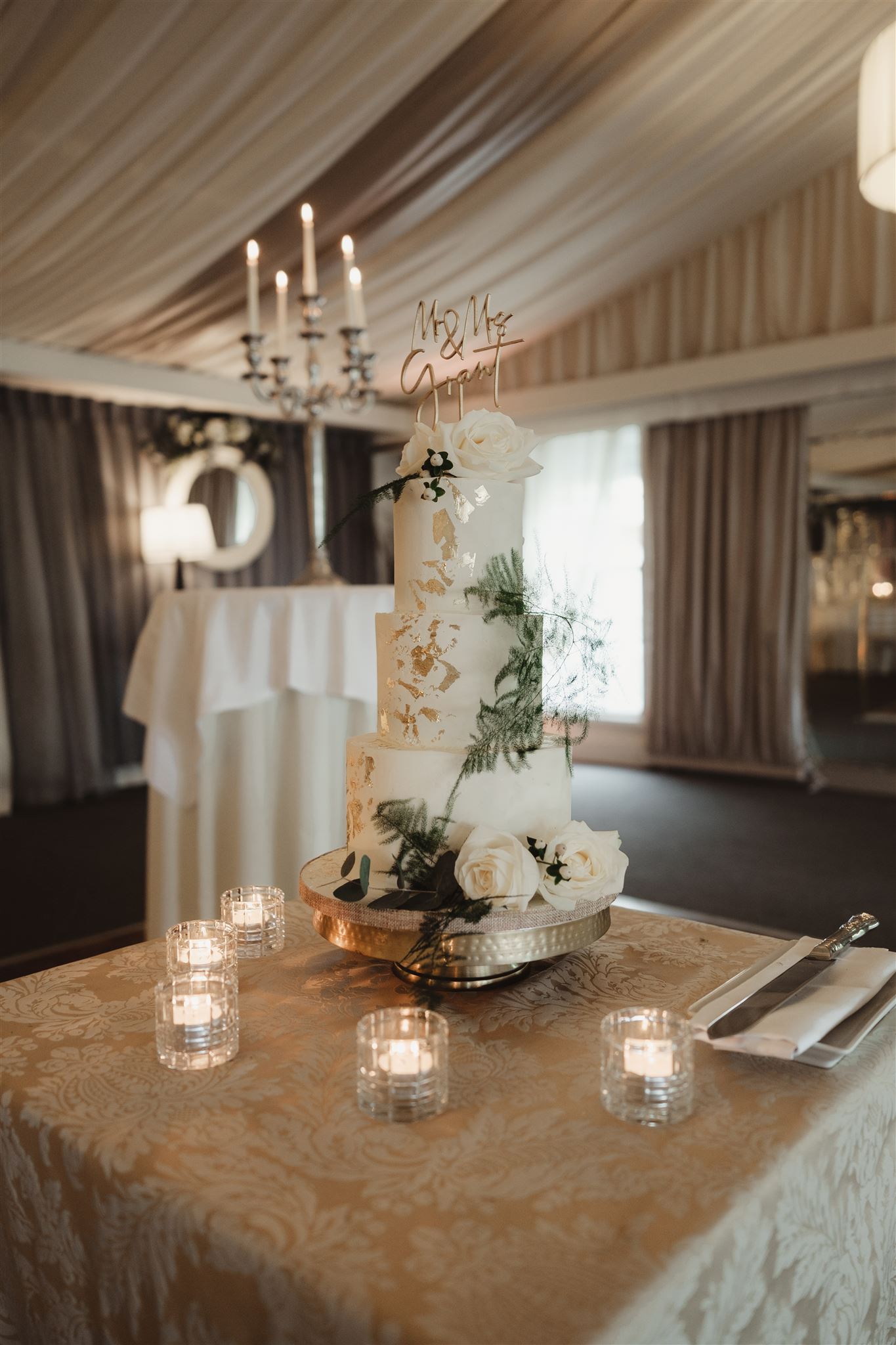 Buttercream wedding cake with fresh flowers and gold leaf Tipperary