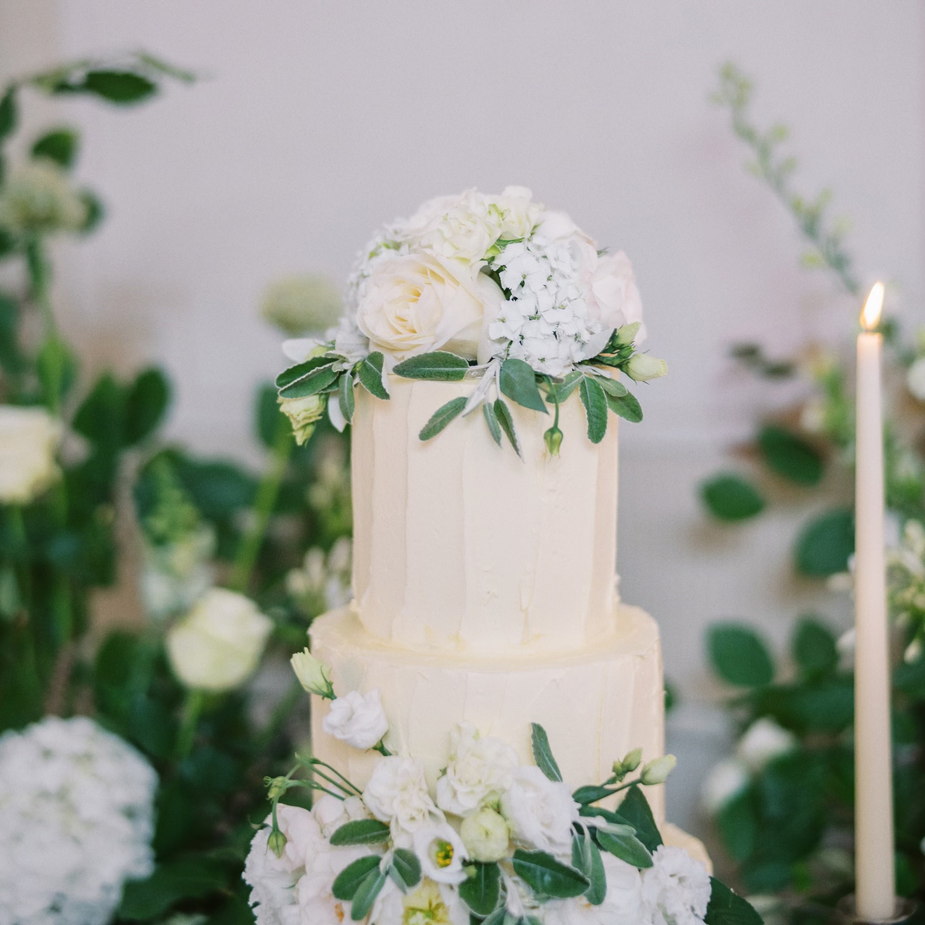 Buttercream wedding cake with fresh flowers Tipperary